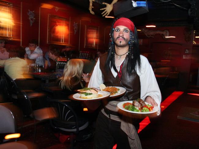 A Jack Sparrow-inspired waiter brings diners their food at Dracula's Theatre Restaurant in 2005. Picture: Rob Baird