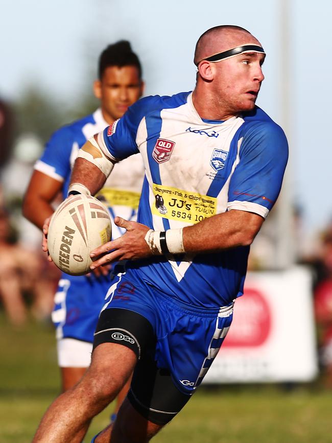 Action from the Bycroft Cup rugby league preliminary final between the Tugun Seahawks (blue) and the Bilambil Jets (green), held at Boyd Street Oval, Tugun. Tugun's Sam Rowlings.