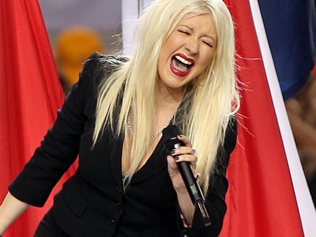 ARLINGTON, TX - FEBRUARY 06:  Singer Christina Aguilera performs during the Bridgestone Super Bowl XLV Pregame Show at Dallas Cowboys Stadium on February 6, 2011 in Arlington, Texas.  (Photo by Christopher Polk/Getty Images)