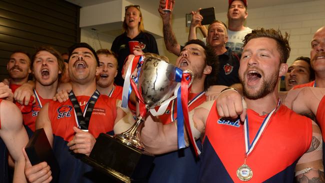 Chelsea Heights players celebrate after defeating Murrumbeena.