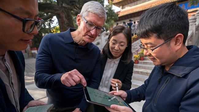 Apple chief executive Tim Cook, pictured on a visit to Beijing, said the company’s Chinese stores reopened after coronavirus infections fell. Picture: CAI YANG/XINHUA/ASSOCIATED PRESS