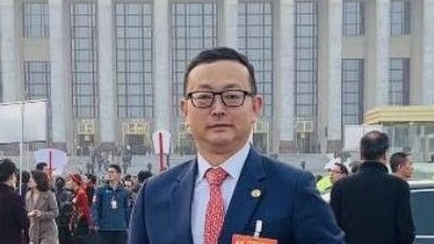 Yang Tengbo outside the Great Hall of the People in Beijing.