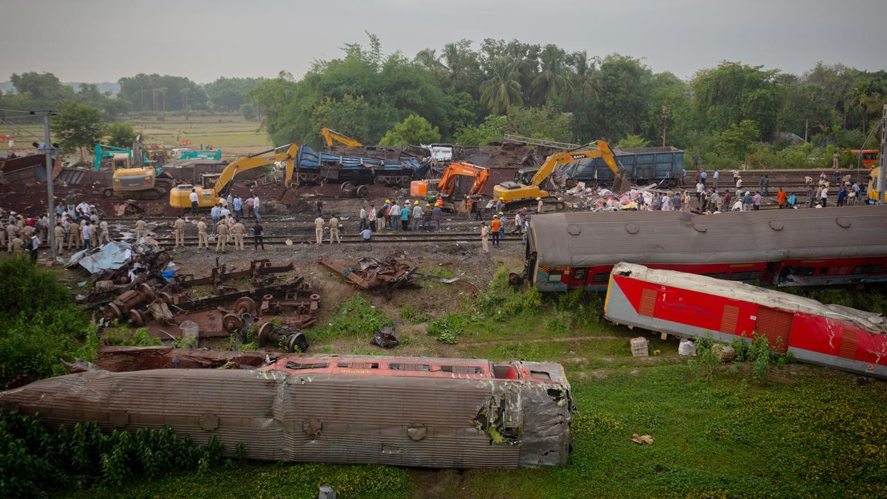The wreckage of rail coaches lies next to train tracks on in Bahanaga village, India. Local media reports said that the death toll from the deadly crash was approaching 300 as emergency services continued to comb through the wreckage for victims. (Picture: Abhishek Chinnappa/Getty Images