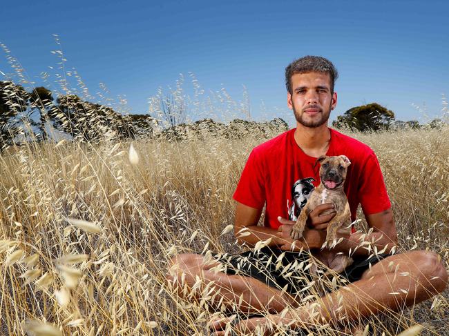 13/12/2018Bowe Roads 19yrs who suffers from Rheumatic heart disease with his pup Bella in Dowerin.Pic Colin Murty The Australian