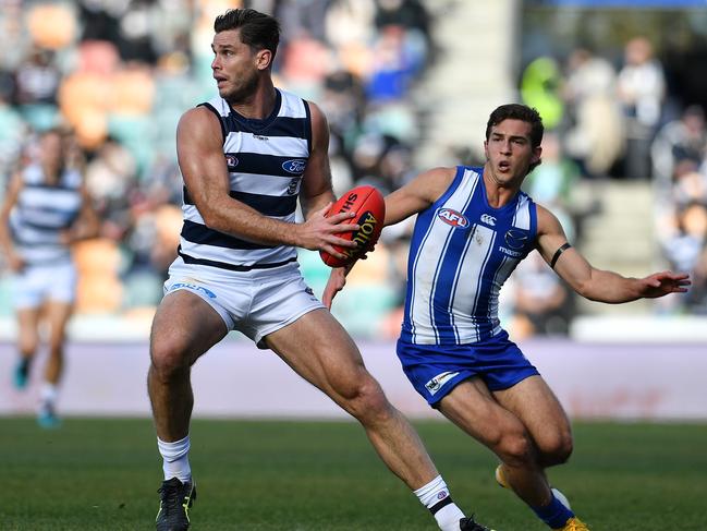 Geelong’s Tom Hawkins outmanoeuvres his North Melbourne opponent during their match at Blundstone Arena in July. Picture: Getty