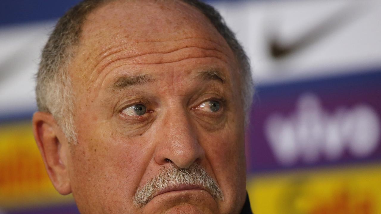 Brazil's coach Luiz Felipe Scolari gestures during a press conference at the Granja Comary training center in Teresopolis, Brazil, Wednesday, July 9, 2014. Brazilians woke up this morning to dreadful headlines describing their soccer team's historic defeat of 7-1 to Germany in the World Cup's semifinal. (AP Photo/Leo Correa)