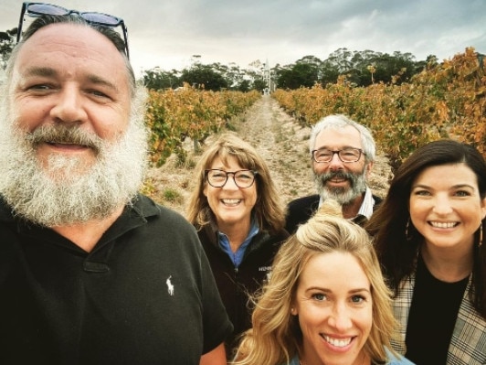 Actor Russell Crowe is in Adelaide and visited the Henschke winery in the Barossa Valley. Here he’s pictured with the Henschke family, including winemaker Stephen and wife Prue, and their daughter Justine, and rumoured new girlfriend, Britney Theriot, front. Picture: Henschke/Instagram.