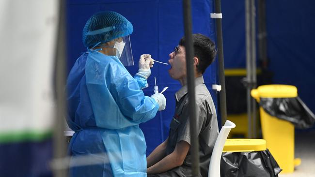 A swab is taken at a Covid-19 testing centre outside immigration headquarters in Hong Kong. Picture: AFP