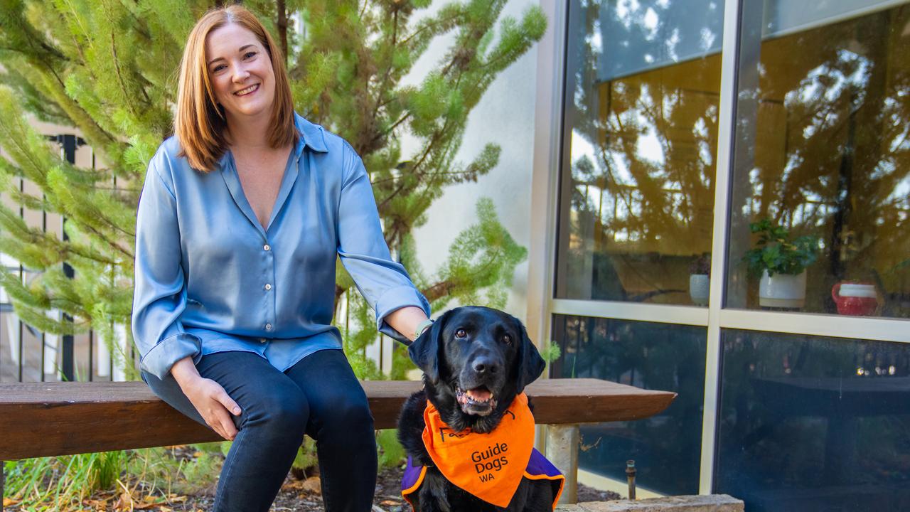 Edith Cowan University criminology researcher Dr Suz Rock with Winston the justice dog.