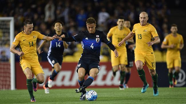 Keisuke Honda of Japan (centre) is seen in action during the 2018 FIFA World Cup Qualifier game between Australia and Japan at Etihad Stadium in Melbourne.