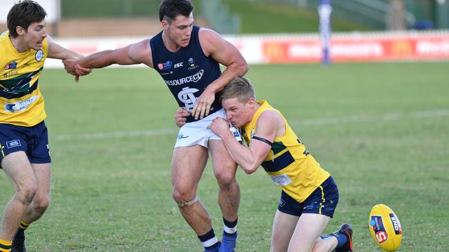 South Adelaide’s Liam Fitt is tackled by Louis Sharrad and Joe Sinor of the Eagles. Picture: AAP Image/Keryn Stevens