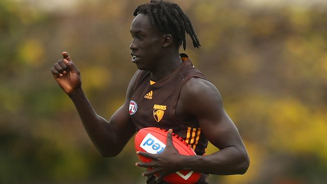 MELBOURNE, AUSTRALIA - MARCH 26: Changkuoth Jiath of the Hawks runs with the ball during a Hawthorn Hawks AFL training session at Waverley Park on March 26, 2021 in Melbourne, Australia. (Photo by Mike Owen/Getty Images)