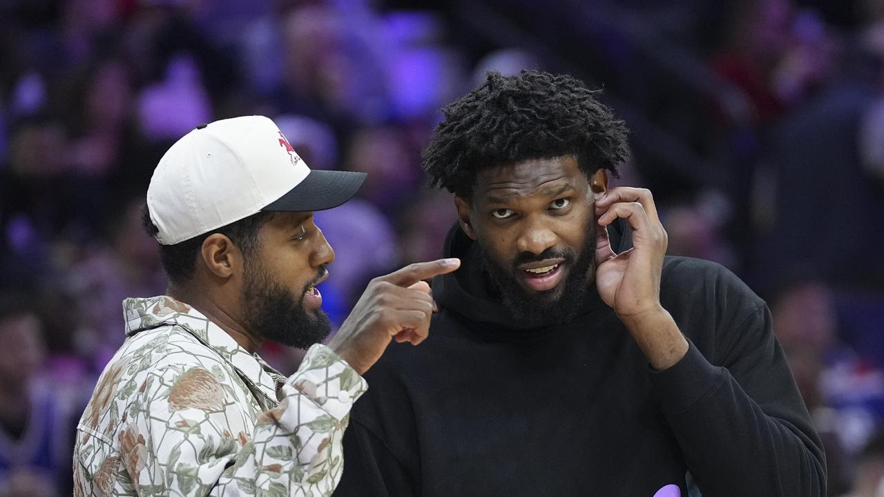 Joel Embiid (right), seen here with Paul George, has been suspended by the NBA. (Photo by Mitchell Leff/Getty Images)