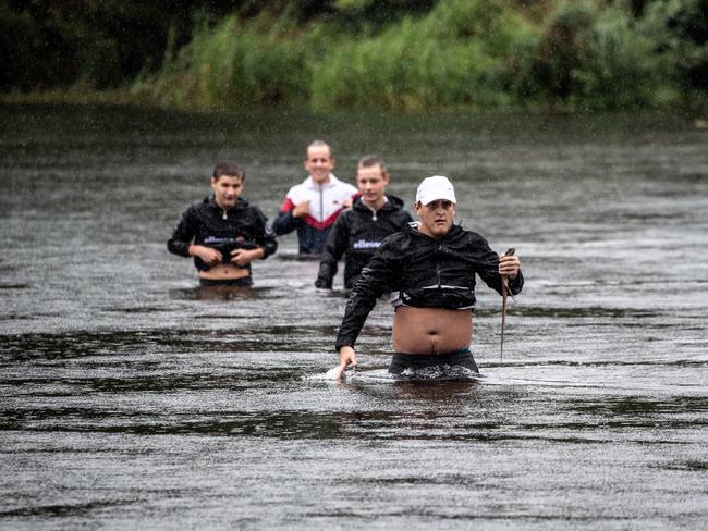 Penrith locals (front to back) Jeremey Hemming, Tyrone Houghton Hood, Cameron Hemming &amp; Jaidyn Wiseman photographed crossing the Napean River, near the Nepean Rowing Club in Penrith on Saturday. Picture: Monique Harmer