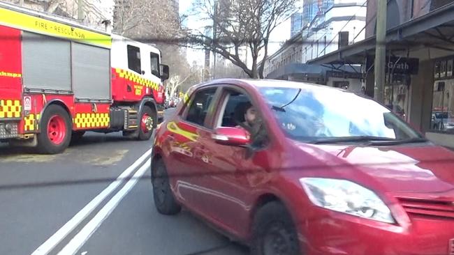 The driver of the red car is seen in the video jostling with a silver car also believed to be following Lohan. Picture: Matrix