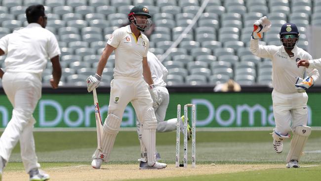 Indian players celebrate after dismissing Australia’s Shaun Marsh.