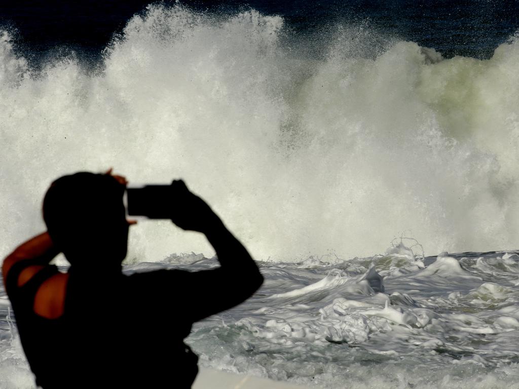 An amateur photographer captures the big swell at Newcastle Ocean Baths. Picture: Peter Lorimer