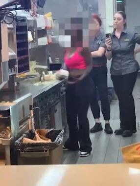 A still from the video footage showing the woman behind the counter.