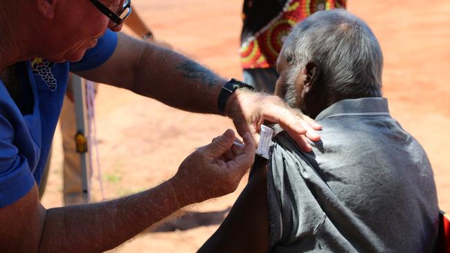 A Beagle Bay community member receives a coronavirus vaccine last week. A vaccine blitz across the Kimberley has begun to lift alarmingly low rates among the region’s approximately 14,300 Aboriginal residents.