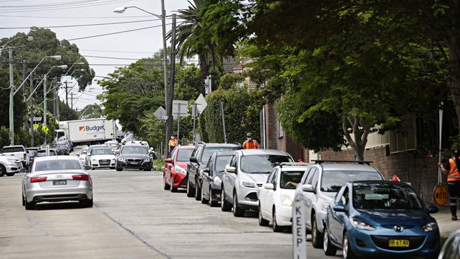 A long line of cars wait to get tested at the Inner West Council Works Depot. Picture: Adam Yip