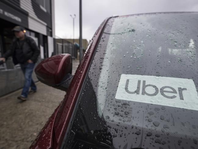 An Uber driver's vehicle is seen after the company launched service, in Vancouver, Friday, Jan. 24, 2020. Ride-hailing companies Uber and Lyft say they are on the road in Metro Vancouver with limited service, less than a day after receiving long-awaited approval for an operating license. (Darryl Dyck/The Canadian Press via AP)