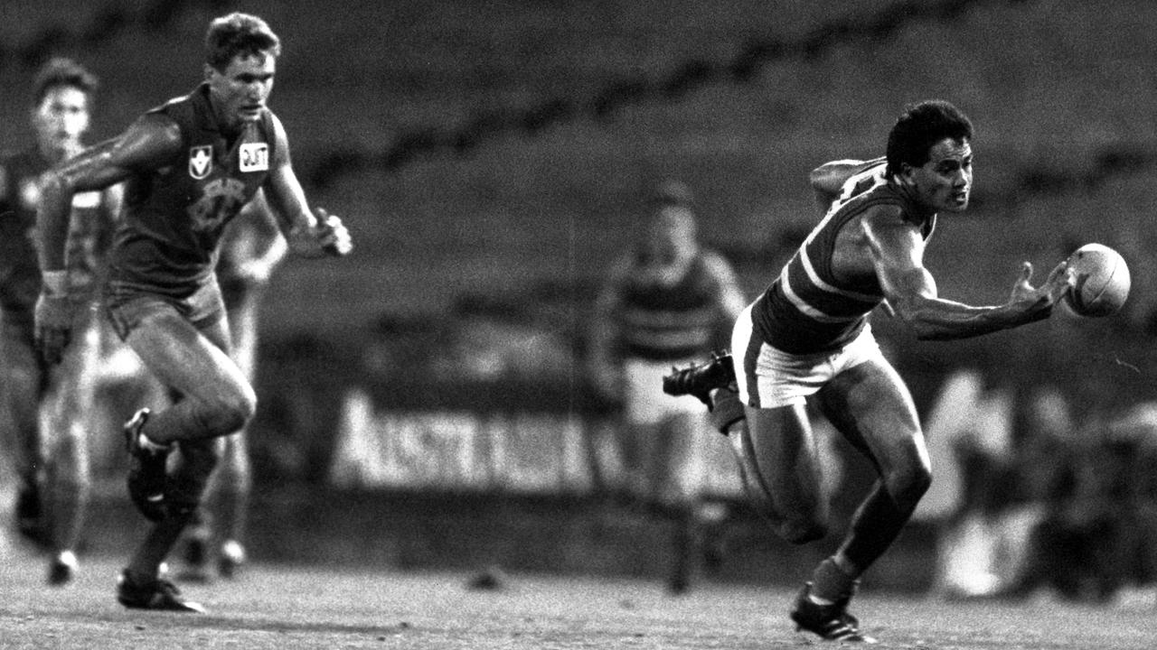 Grant Lawrie chases Michael McLean during the 1988 season.