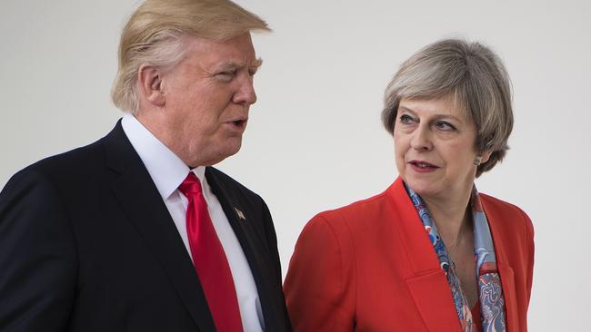 U.S. President Trump held Theresa May’s hand because of his fear ‘stairs and slopes’. Picture: AFP/Brendan Smialowski