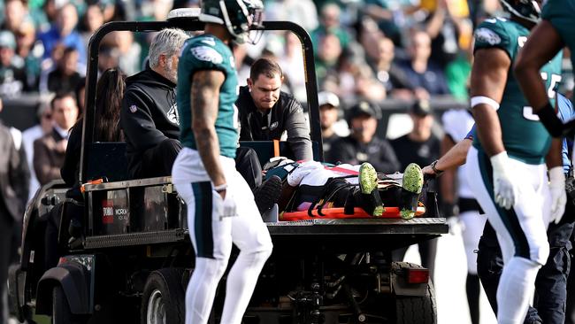 PHILADELPHIA, PENNSYLVANIA - JANUARY 01: Teammates stand around Josh Sweat #94 of the Philadelphia Eagles after an injury against the New Orleans Saints during the first quarter at Lincoln Financial Field on January 01, 2023 in Philadelphia, Pennsylvania. (Photo by Dustin Satloff/Getty Images)