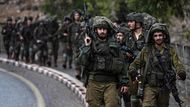 Israeli army soldiers patrol an undisclosed area in northern Israel bordering Lebanon. Picture: Aris Messinis/AFP