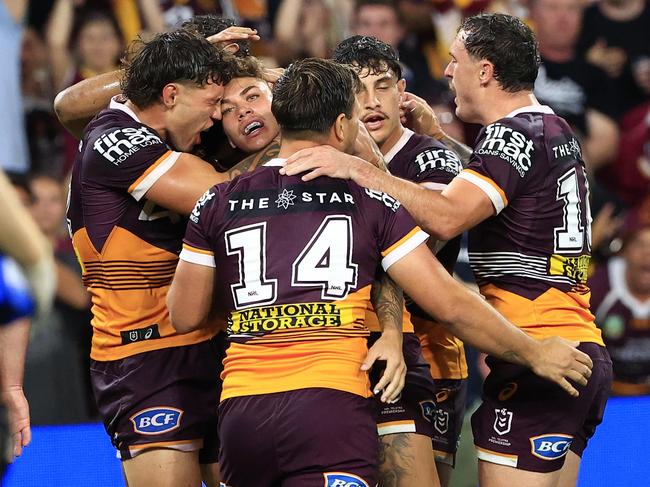 Broncos players celebrate Reece Walsh’s try. Picture: Adam Head