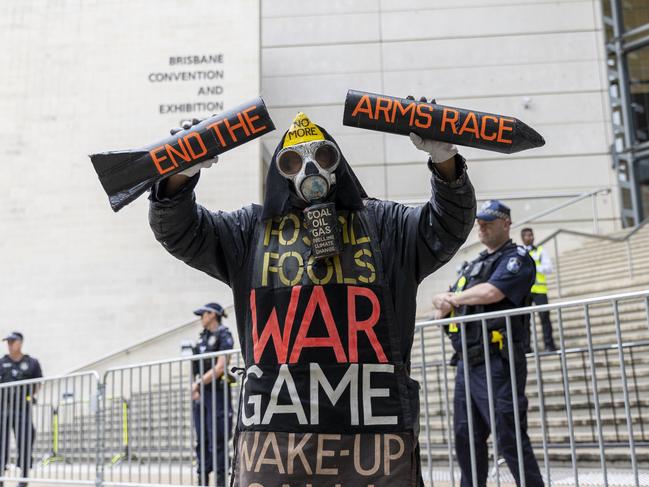 A protester outside the Brisbane Convention Centre rallying against the 2021 Land Forces Expo. Picture: Sarah Marshall