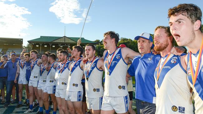 Athelstone players sing the club song after winning the division two grand final. Picture: Brenton Edwards