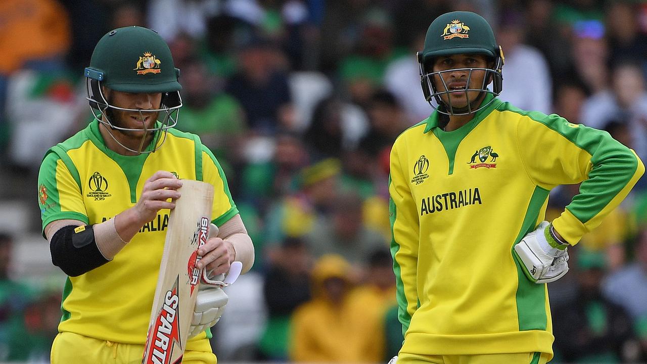 David Warner stands with Usman Khawaja. Photo: Paul Ellis/AFP.