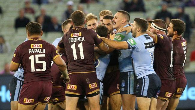 Maroons and Blues players clash during Origin I at the MCG. Photo: AAP