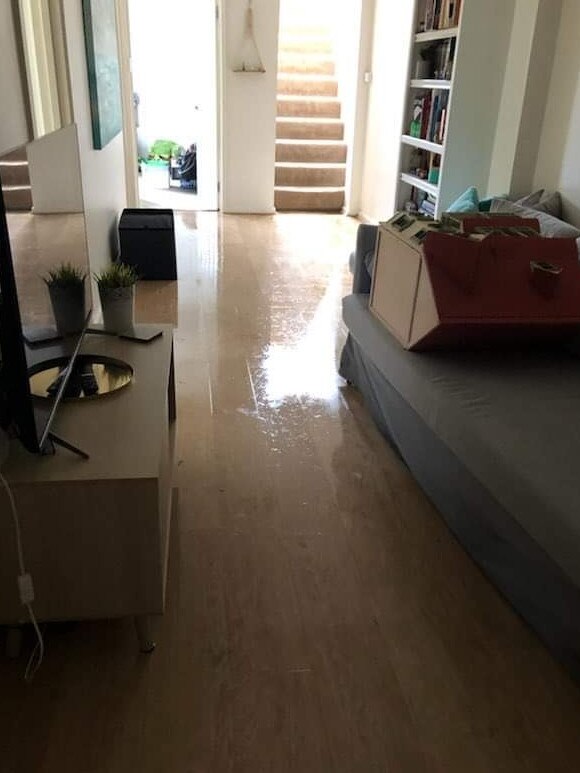 Floodwater downstairs at Kathryn’s home. Picture: Supplied