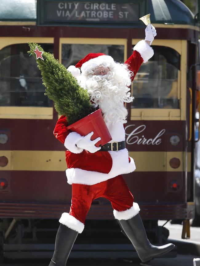 Santa even takes a trip on the City Circle tram. Picture: David Caird