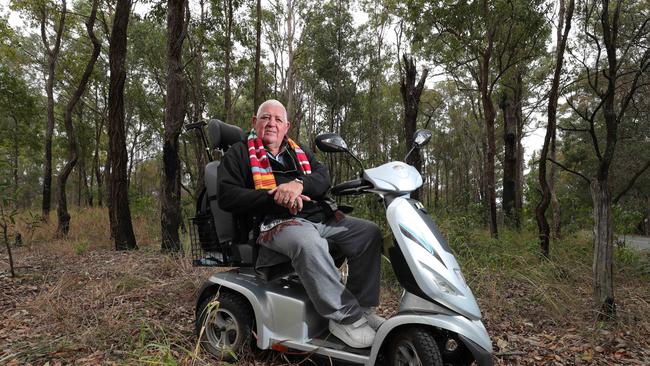 Vietnam vet Rob Wiseman, 73, is looking for the teenagers who helped him when his scooter got tangled in some barbed wire from an old fence and left him stranded in bushland next to Gilston Rd at Nerang. Picture: Glenn Hampson.