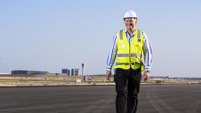 Paul Coughlan walks on the tarmac of the new Brisbane Airport runway. Picture: Lachie Millard