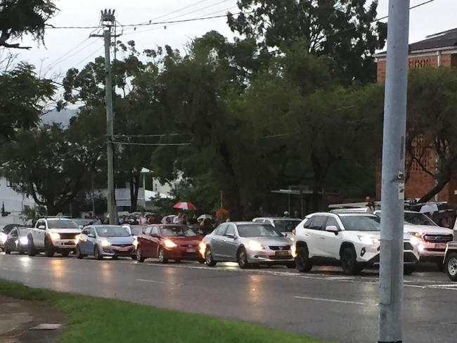 Lines stretch along a footpath outside the St Stephen's Hall in Coorparoo. Image: Supplied