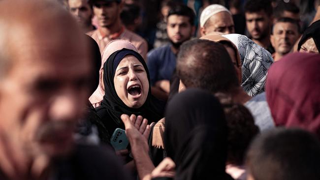 A woman reacts during the funeral of the Abu Erjela family, killed in Israeli bombing on Khan Yunis in the southern Gaza Strip on November 11. Picture: AFP