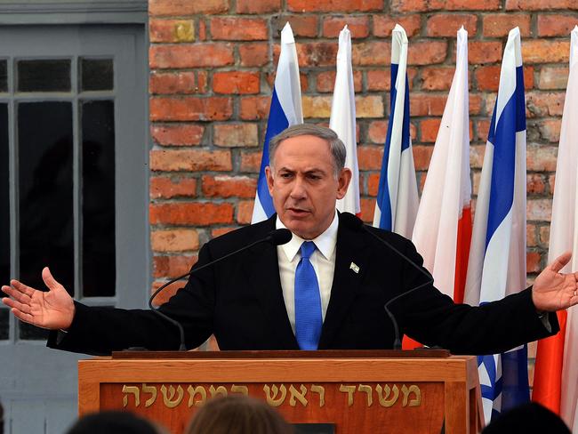 (FILES) Israeli Prime Minister Benjamin Netanyahu delivers a speech during the opening of the Permanent Exhibition SHOAH at the former Nazi death camp Auschwitz-Birkenau State Museum, Block 27 in Oswiecim, Poland, on June 13, 2013. Poland's government said on January 10, 2025 it would grant free access to Israeli officials wanting to attend the 80th anniversary of the Auschwitz-Birkenau liberation despite an arrest warrant issued for the Israeli Prime Minister Benjamin Netanyahu. (Photo by JANEK SKARZYNSKI / AFP)