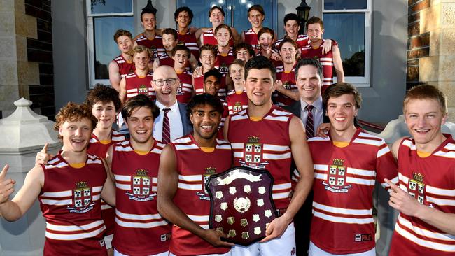 Prince Alfred College players and coaches celebrates after winning a third college football Messenger Shield championship in a row. Picture: Tricia Watkinson