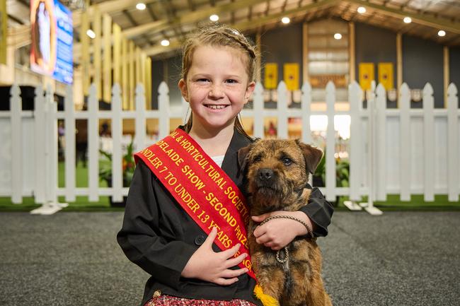 Maddie Clarke, 7, with her dog, Gary, 2, at the Royal Adelaide Show. Picture: Matt Loxton