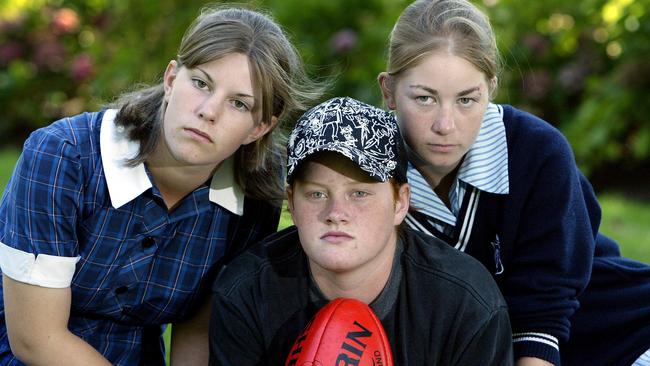 Penny Cula-Reid (right) with Helen Taylor (left) and Emily Stanyer in 2003, before taking on Football Victoria at VCAT.