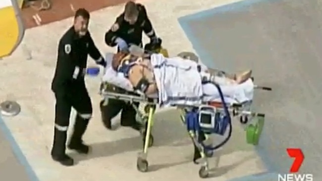 Tony Mokbel being worked on by paramedics at Barwon prison Lara after being attacked by inmates. Picture: Seven News