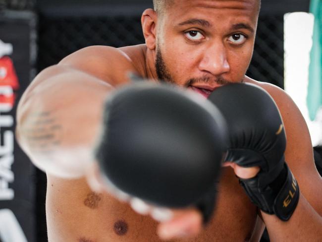 (FILES) In this file photo taken on September 14, 2021, French MMA heavyweight athlete Ciryl Gane poses in a gymnasium, in Paris. - Gane is set to fight against MMA legend Jon Jones in an attempt to get the UFC heavyweight belt. (Photo by GEOFFROY VAN DER HASSELT / AFP)