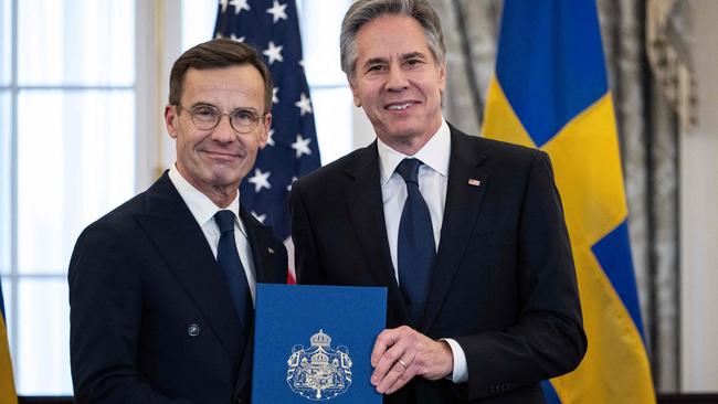 US Secretary of State Antony Blinken receives the NATO ratification documents from Swedish Prime Minister Ulf Kristersson during a ceremony at the US State Departmen. Picture: AFP.