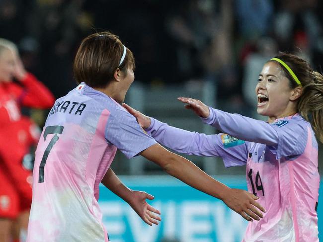 Japan's midfielder #07 Hinata Miyazawa (L) celebrates scoring her team's third goal with teammate Japan's midfielder #14 Yui Hasegawa during the Australia and New Zealand 2023 Women's World Cup round of 16 football match between Japan and Norway at Wellington Regional Stadium in Wellington on August 5, 2023. (Photo by Marty MELVILLE / AFP)