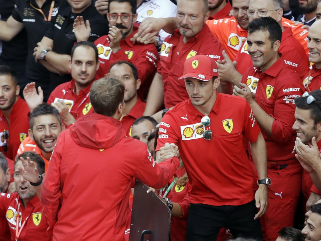 Sebastian Vettel congratulates Charles Leclerc.