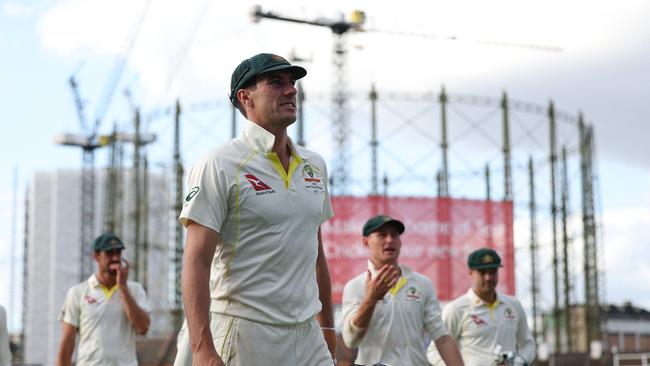 Australia's Pat Cummins leads his players from the field at the end of play on day three of the fifth Ashes cricket Test. Picture: AFP